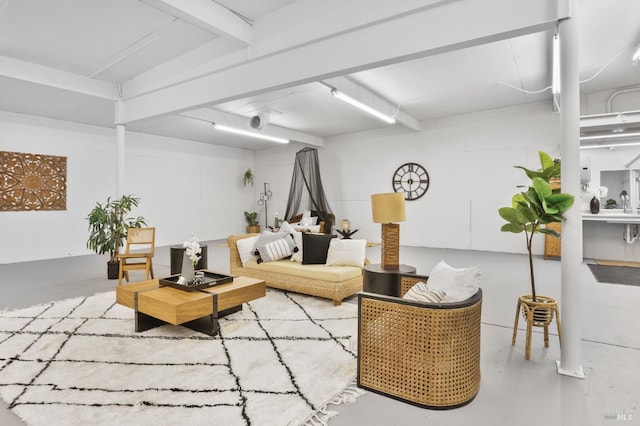 living area featuring finished concrete floors