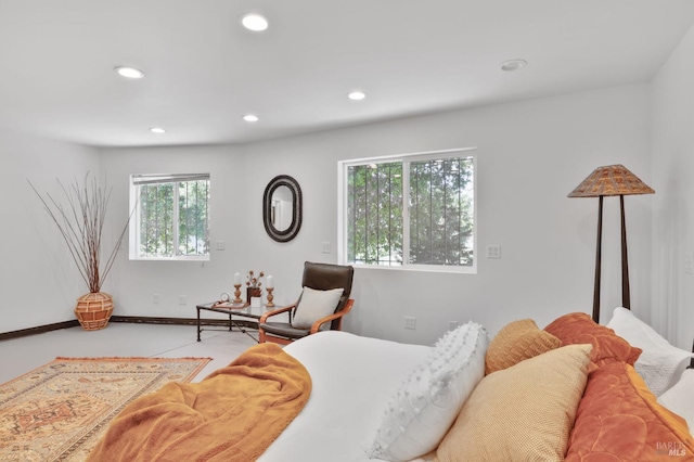 bedroom with recessed lighting and multiple windows