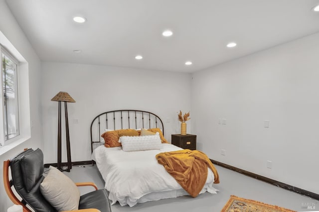 bedroom featuring recessed lighting and baseboards