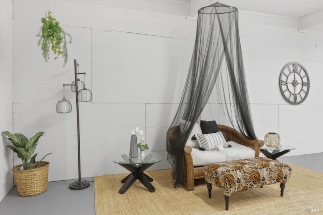 living area with concrete floors