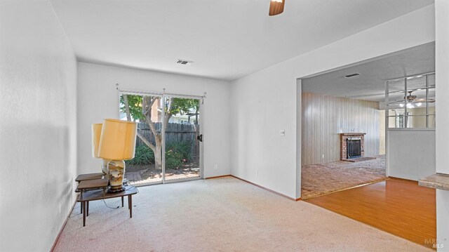 unfurnished room with visible vents, ceiling fan, and carpet floors