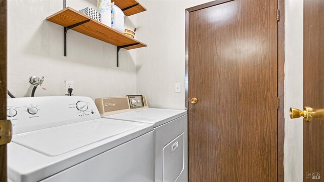 clothes washing area featuring laundry area and washer and dryer