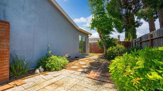 view of yard with a patio and a fenced backyard