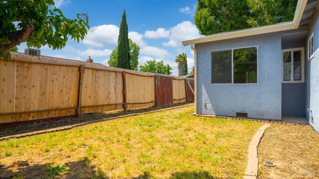 view of yard with a fenced backyard