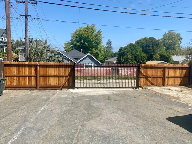 view of gate with fence