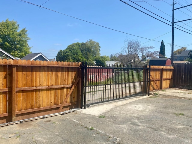view of gate featuring fence