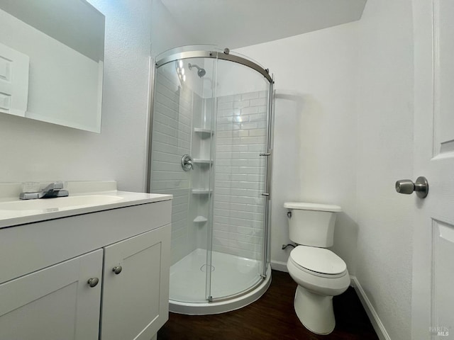 412 Kentucky St, Vallejo, CA 94590 - full bathroom with wood finished floors, a stall shower, vanity, toilet, and baseboards
