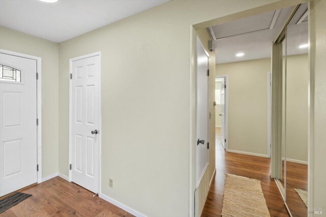 entrance foyer featuring baseboards and wood finished floors