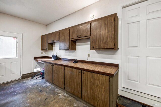kitchen with unfinished concrete floors