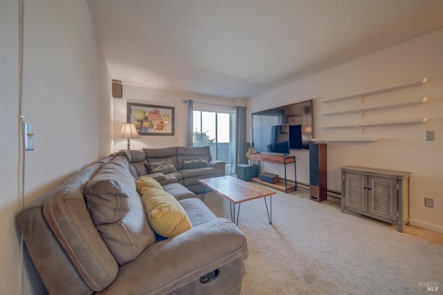 carpeted living area featuring baseboards
