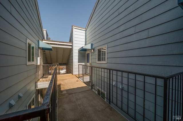 view of property exterior featuring a balcony