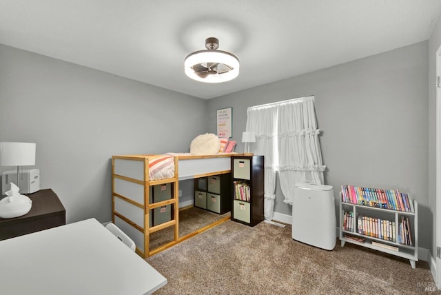 carpeted bedroom with baseboards