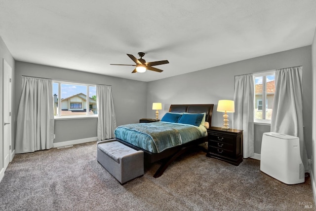 bedroom with carpet flooring, baseboards, and a ceiling fan