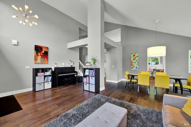living room with baseboards, stairs, a notable chandelier, and wood finished floors