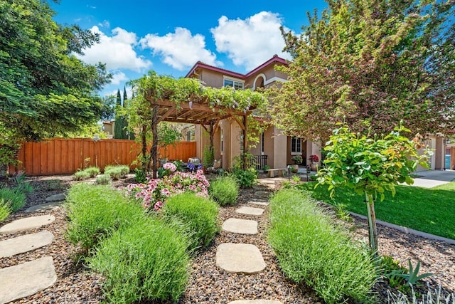 view of yard featuring fence and a pergola