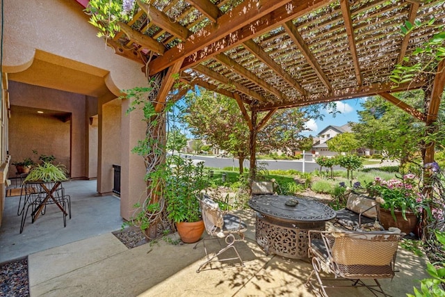 view of patio / terrace featuring fence and a pergola
