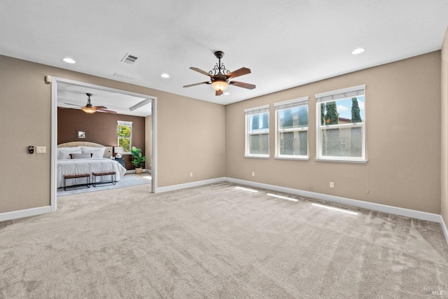 unfurnished bedroom with carpet floors, visible vents, baseboards, ceiling fan, and recessed lighting