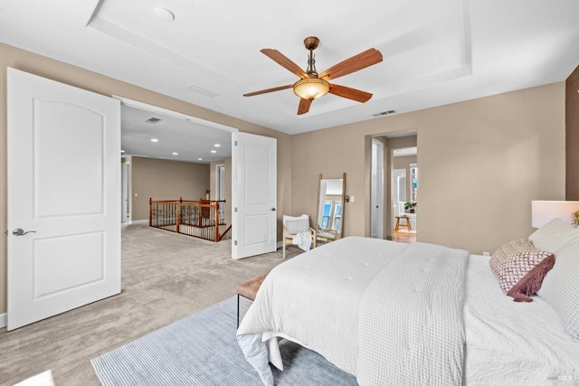 bedroom with light colored carpet, ceiling fan, visible vents, and recessed lighting