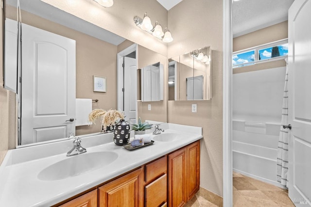 full bath with double vanity and a sink