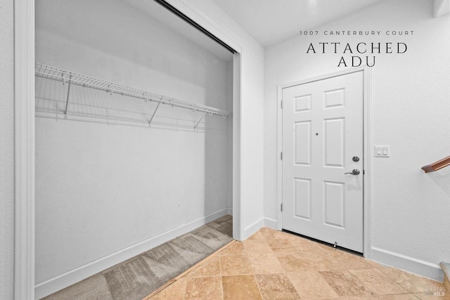 interior space featuring baseboards