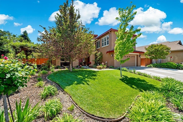 view of front of house with fence, a front yard, stucco siding, concrete driveway, and a tile roof