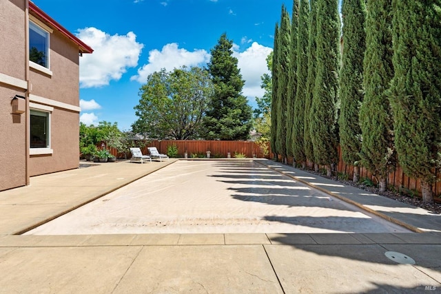 view of patio featuring fence