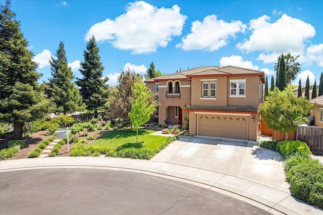 traditional home with a garage, fence, stucco siding, a tiled roof, and concrete driveway