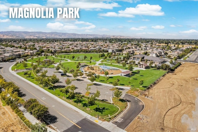 birds eye view of property with a residential view and a mountain view