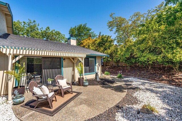 view of patio / terrace featuring fence