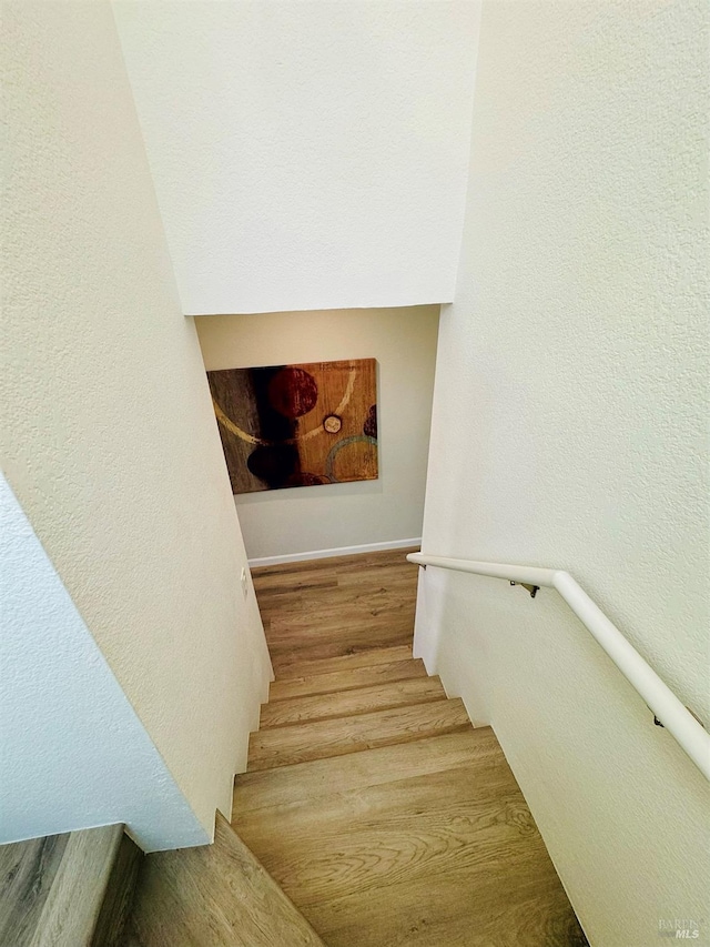 19 4th St, Richmond, CA 94801 - stairs featuring wood finished floors and a textured wall