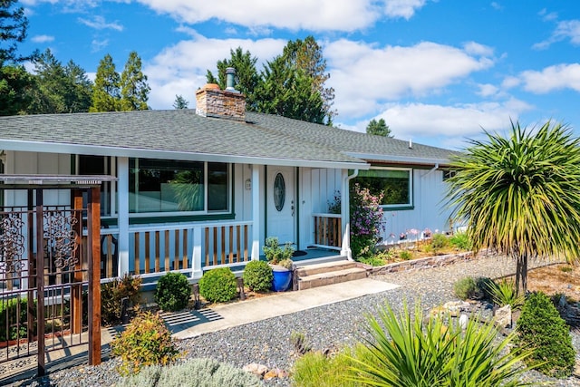 186 Easy St, Willits, CA 95490 - view of front facade with covered porch, board and batten siding, roof with shingles, and a chimney