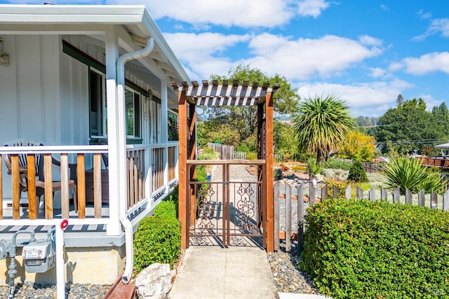 exterior space featuring fence, a gate, and a pergola