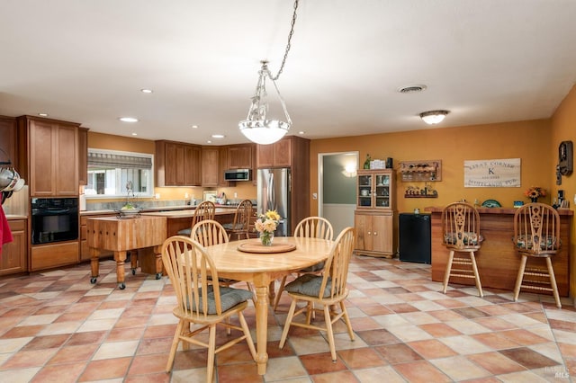 dining space with recessed lighting and visible vents