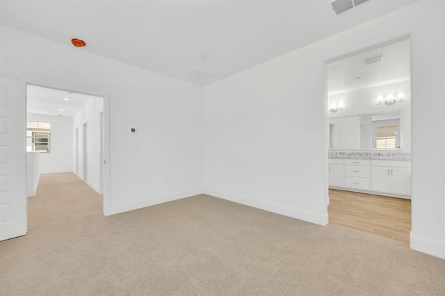 10592 Trill Way, Elk Grove, CA 95757 - unfurnished bedroom featuring visible vents, lofted ceiling, baseboards, light colored carpet, and connected bathroom