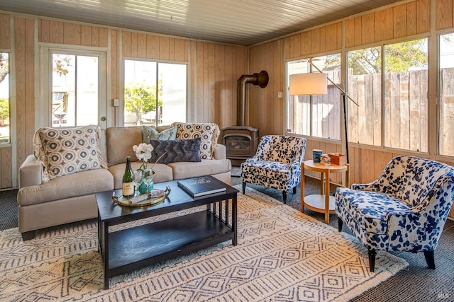 sunroom / solarium featuring a wood stove