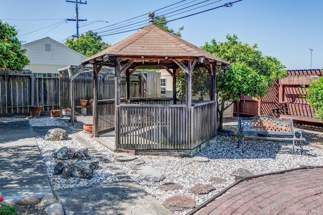 exterior space with a fenced backyard and a gazebo