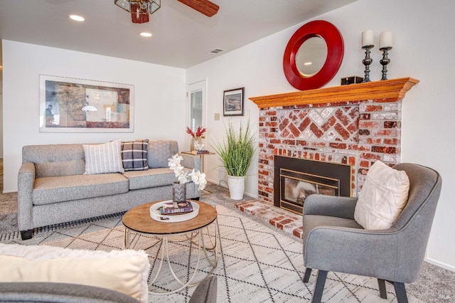 living room with carpet floors, a fireplace, baseboards, ceiling fan, and recessed lighting