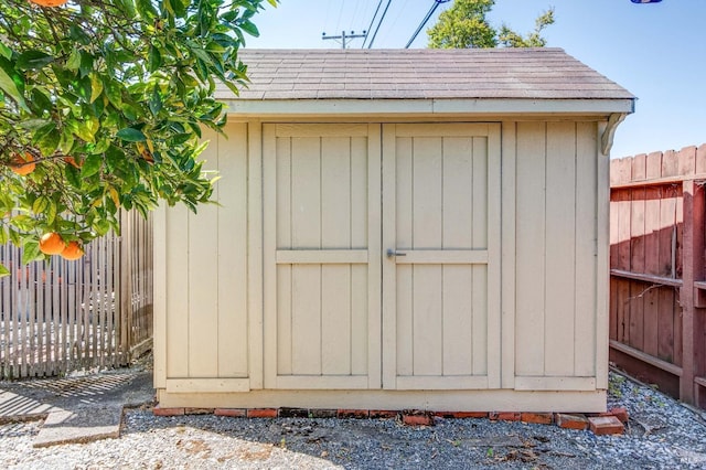 view of shed with a fenced backyard