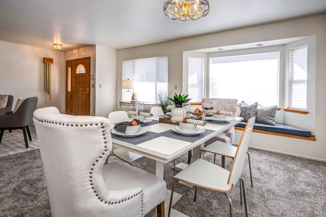 dining area with carpet floors and plenty of natural light
