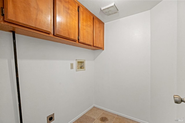 clothes washing area featuring cabinet space, hookup for an electric dryer, baseboards, and washer hookup