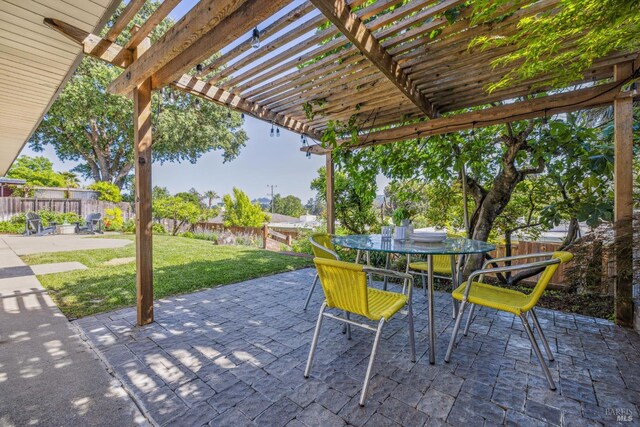 view of patio / terrace featuring a pergola and outdoor dining area