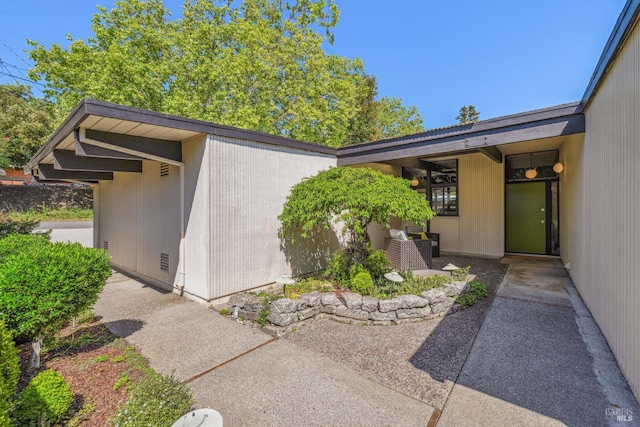property entrance with a patio