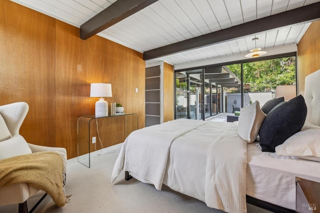 bedroom with beam ceiling, wooden walls, access to exterior, and wooden ceiling