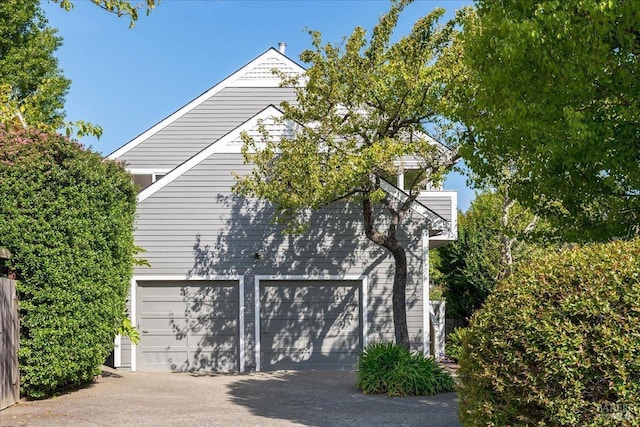 garage with aphalt driveway