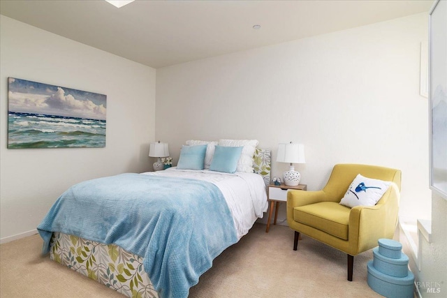 bedroom with baseboards and carpet flooring