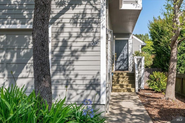 view of home's exterior featuring fence