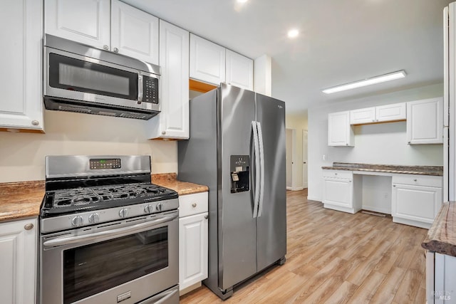 kitchen featuring white cabinets and stainless steel appliances
