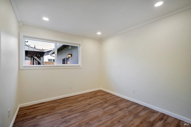 unfurnished room featuring baseboards, ornamental molding, recessed lighting, and wood finished floors
