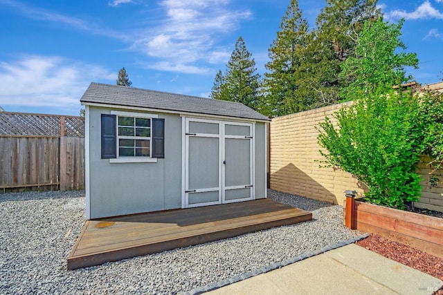 view of shed featuring a fenced backyard
