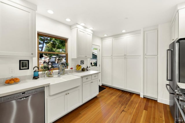 151 Randolph St, Napa, CA 94559 - kitchen with light wood finished floors, a sink, white cabinetry, light countertops, and appliances with stainless steel finishes